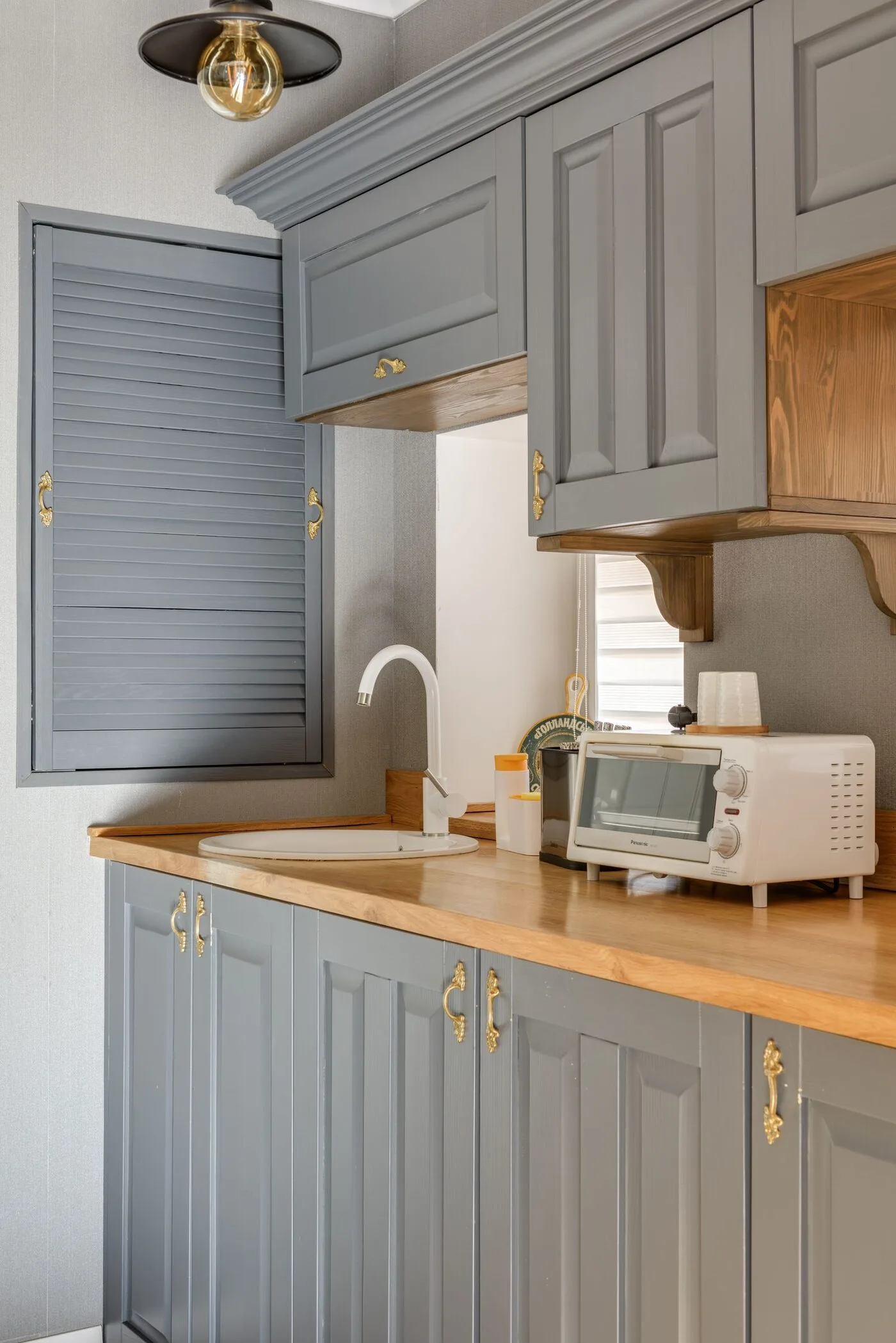 Kitchen cabinets refinished in a smooth grey finish