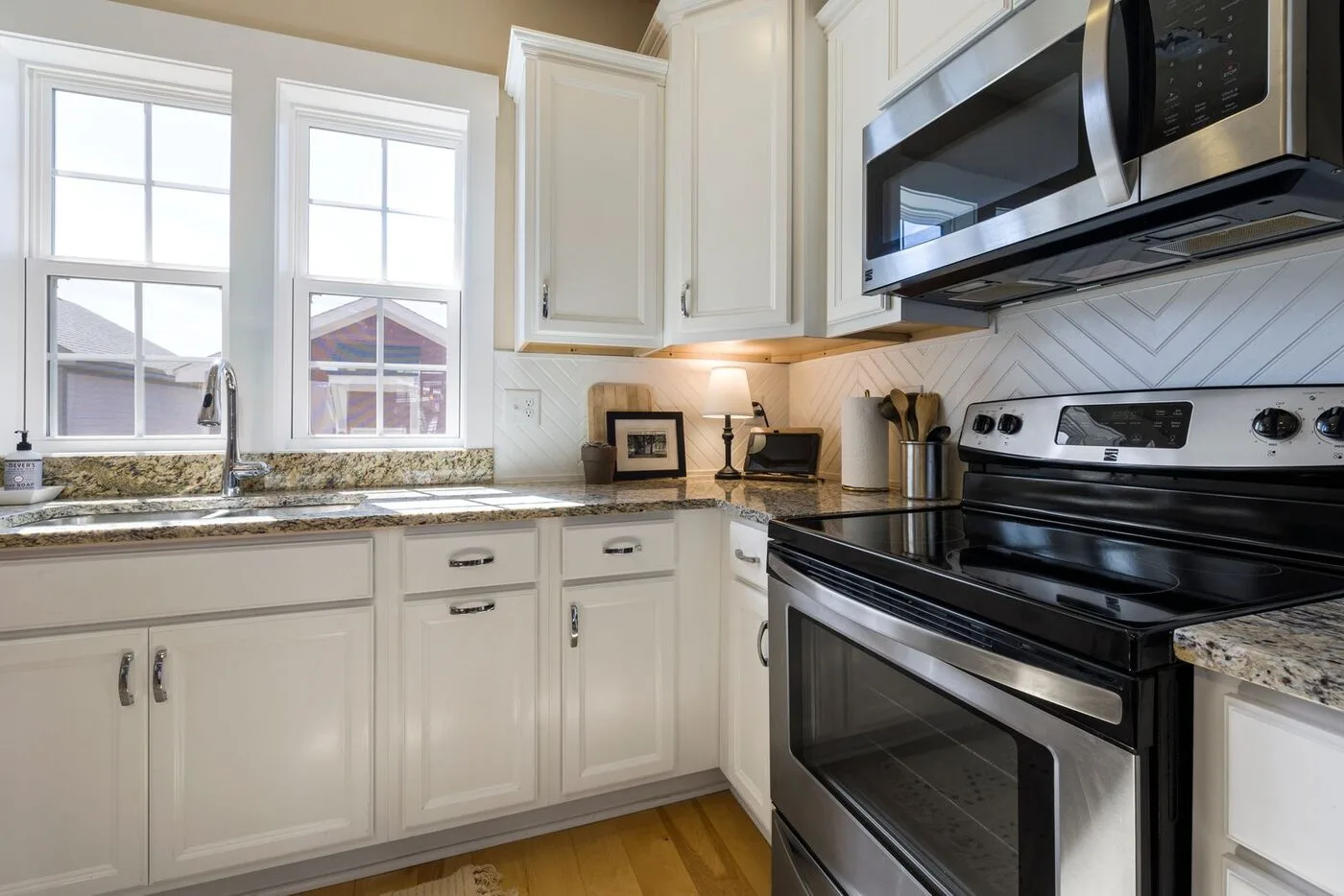 Kitchen cabinets refinished in a smooth white finish