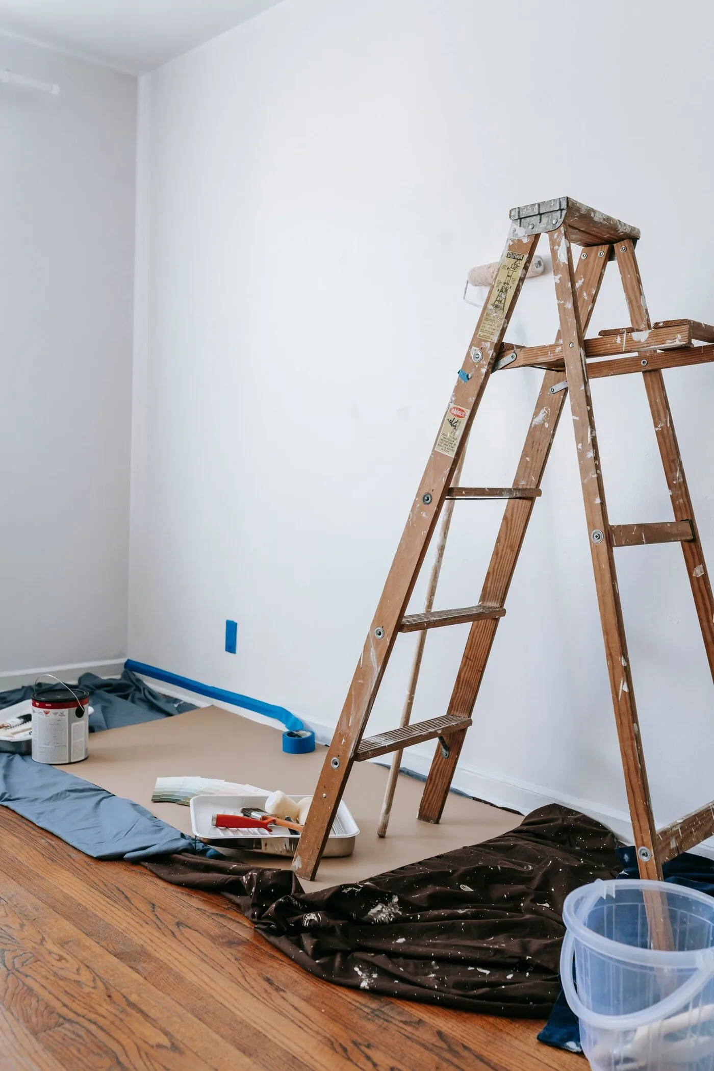 Room prepared for painting with furniture covered